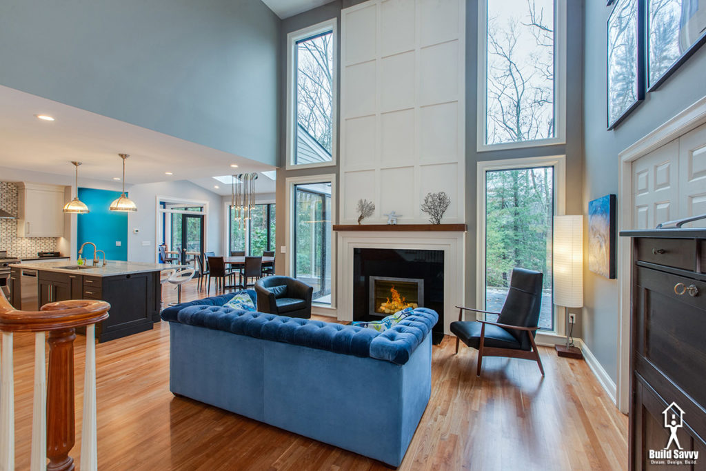 Blue couch in front of a fireplace in a living room