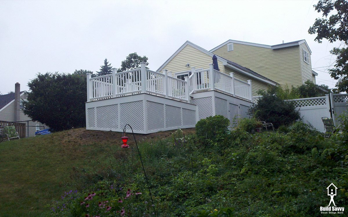 A white deck with white lattice in full view, built by Build Savvy