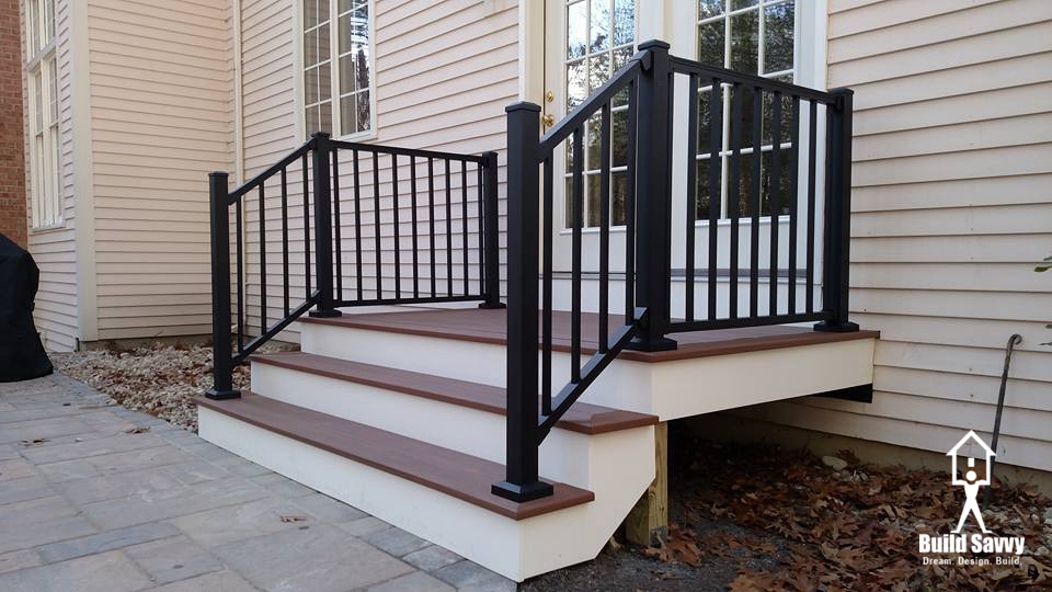 Finished black, white, and brown front porch steps